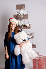 Beautiful happy woman in Santa Claus clothes
