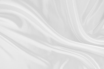 White fabric texture that is white silk background with beautiful soft blur pattern.