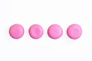Set of pink french macarons cakes isolated on white background