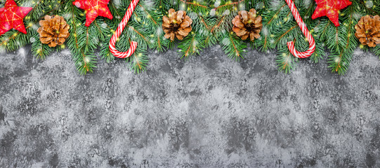 Christmas border made of fir branches, festive red decoration