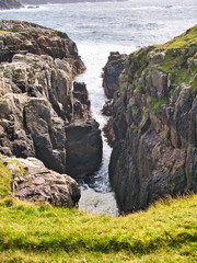 A small geo near Culswick Broch on the west of Mainland Shetland, UK. The bedrock is Sandsting...