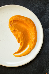 portion pumpkin and turkey or chicken (festive treat, delicious main course, healthy food, mashed potatoes) menu concept. food background. copy space. Top view