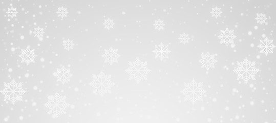 white Snowflakes and snowfall on a cold silver winter christmas background