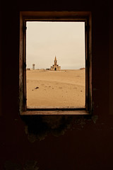 View through a window of the church at the abandoned village of Ilha dos Tigres, Angola.