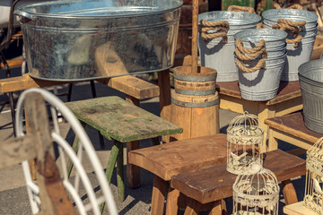 Market stall with objects and old things at the weekend flea market in the city center. Concept....