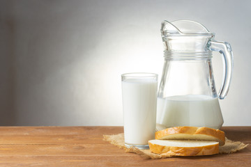 Wonderful still life with a view of a jug of milk and fresh bread
