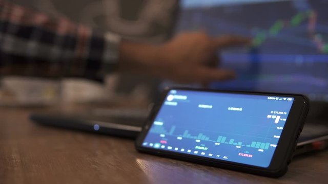 Block-chain, trading online, Cryptocurrency trend graph. Man touching screen, browse foreign exchange market data, chart. Forex. Crypto currency. Bitcoin cryptocurrency. Candle graph. investment