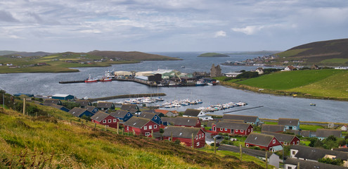 Naklejka premium The town of Scalloway in Shetland, Scotland, UK - the town was the old capital of Shetland and is the largest settlement on the North Atlantic coast of Mainland.