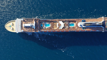 Aerial photo of large cruise liner ship cruising deep blue open ocean sea