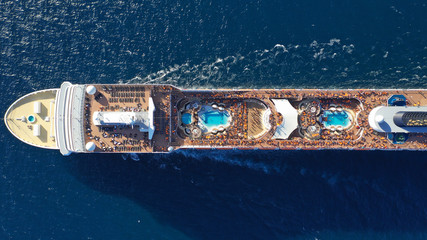 Aerial photo of large cruise liner ship cruising deep blue open ocean sea