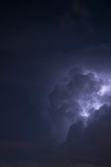 Fototapeta na wymiar Clouds illuminated by lightning.