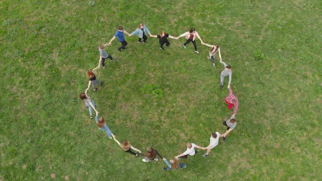 Friendly friends lead a round dance. View from above.