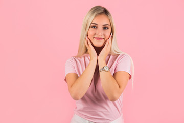 beautiful young woman on pink background