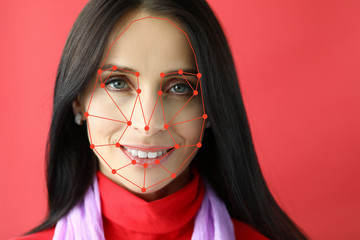 Biometric verification smiling woman portrait on red background. People tracking search concept. Neural visual networks usage