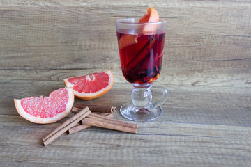 Mulled wine, wine hot drink with spices and grapefruit