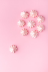 Composition of pink and white Bizet on a pink paper background. Pastel. Top wiev