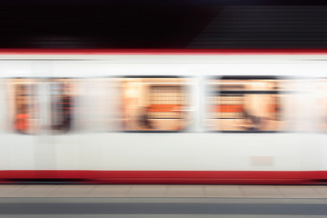 Moving subway train. Defocused traveling train background