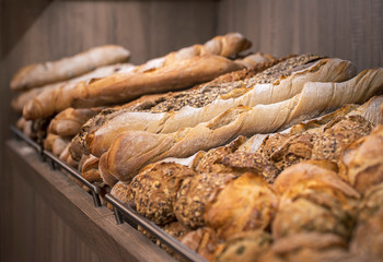 Variety of bread on the shelf. Freshly baked loaves