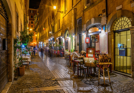 Fototapeta Night view of cozy street in Rome, Italy