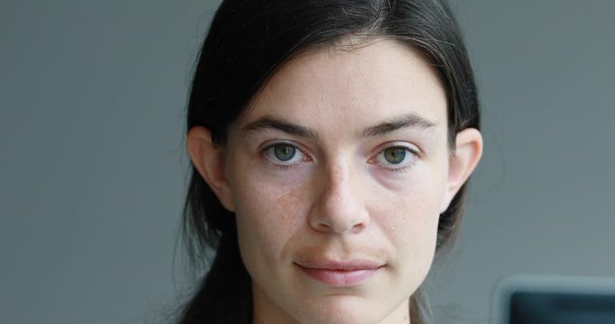 front view of serious woman getting happy