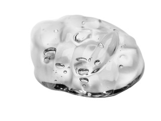 Squeezed cosmetic clear cream gel texture Iisolated on white background. Close up photo of transparent drop of skin care product. High Quality transparent gel with bubbles closeup on white background