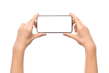 Young woman holding smartphone with blank screen in horizontal orientation