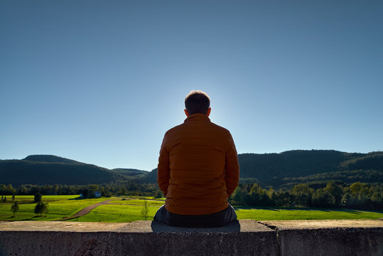 30 Year Old Man Resting Outdoors In The Mountains, Standing Far On The Trail, Looking Into The Distance In A Forest, In Quebec Harrington. Travel To Canada