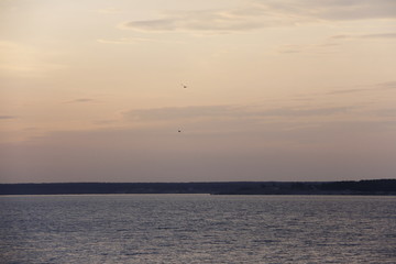 Sunset over the river Volga in warm summer evening