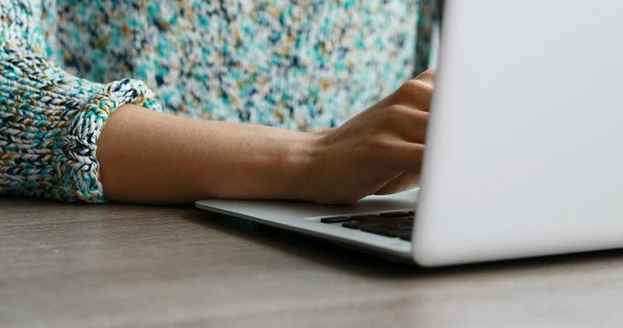 woman writing and then seriously watching at camera