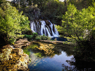Fototapeta na wymiar Aerial view of waterfall on Una river in village Martin Brod in Bosnia and Herzegovina