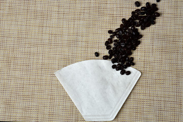 roasted coffee bean and paper colander