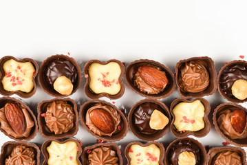 Mix of tasty chocolate candy collection isolated on white. Copy space.