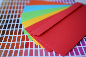 Set of colourful envelopes lying in fantail shape closeup