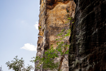 Climber in Labske Udoli, Czech republic. Traditional sport climbing on the sandstone.