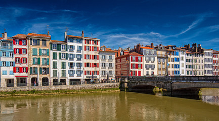 Colorful houses at the Nive river embankment in Bayonne, France