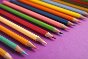 Obraz premium Composition with color pencils on purple background