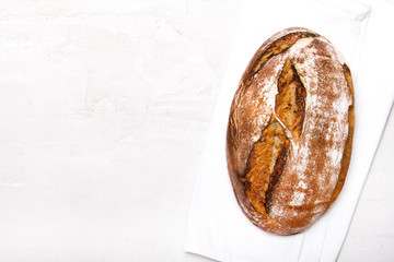 Tasty dark bread  on white background, copy space. Wholemeal bread.
