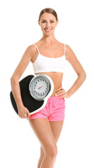 Beautiful young woman with scales on white background. Weight loss concept