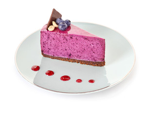 Plate with blueberry cake on white background