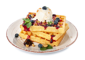 Plate with tasty waffles, ice cream and blueberries on white background