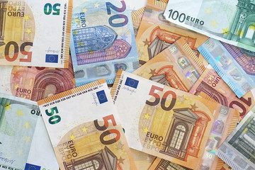 Background with money euro bills. Euro banknotes background. Business, finance, investment, saving and corruption concept.
