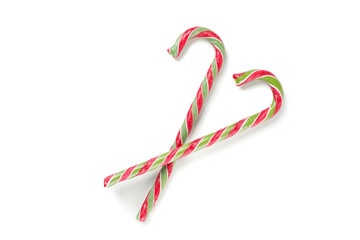 Sweet candy canes isolated on white background