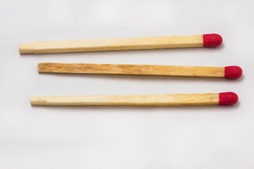 three unlit matchstick in a row