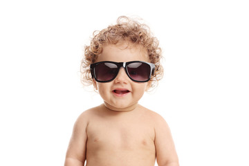 Baby boy wearing a pair of sunglasses