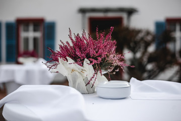 Beautiful wedding decorations. Floral compositions on ceremony. Decorations made of wood with flowers and greenery. lose up