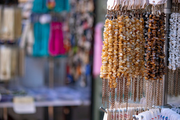 Close up of beads hanging on counter.