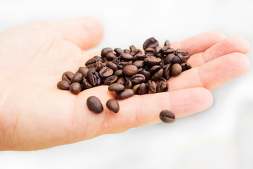 coffee beans falling from hand