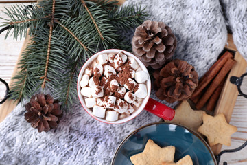 Cup of tasty cocoa with marshmallows and cookies on tray, flat lay