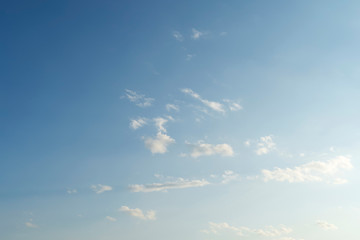 Background blue sky with white clouds. Bright sunny day, blue sky.