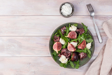 Marinated figs with mozzarella and serrano ham